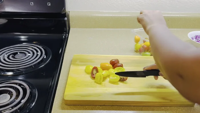 Chop the cucumber, tomato, red onion, and parsley.