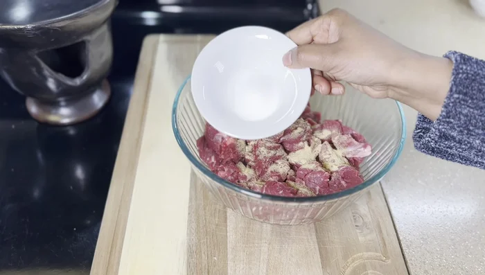 Cook the meat until it's cooked through.
