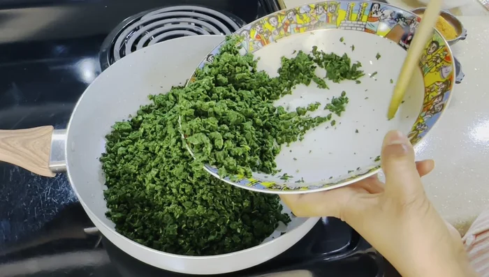 Add the chopped collard greens to the pan and stir well.