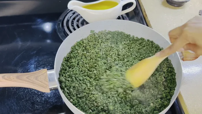 Add the spice blend, salt and pepper to the collard greens and mix.