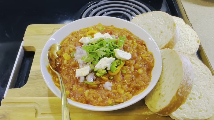 (Missing step - possibly adding tomatoes and spices)