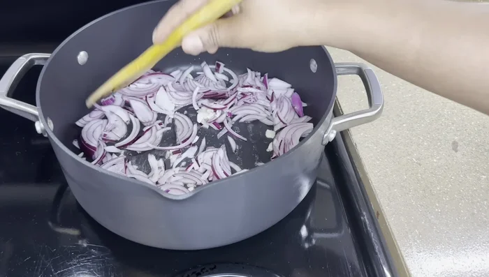 Add the meat to the pot and brown it. Season with salt and pepper. (This step is implied and not explicitly stated in the transcript)