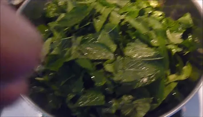 Remove large stems from the amaranth leaves.