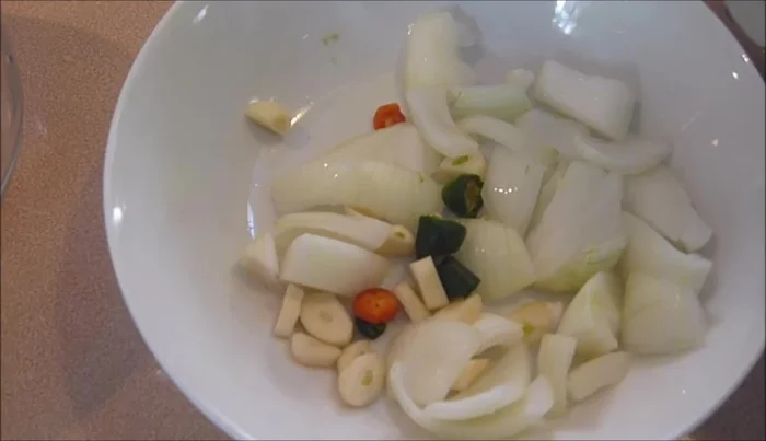 Prepare potatoes by cutting them into chunks.