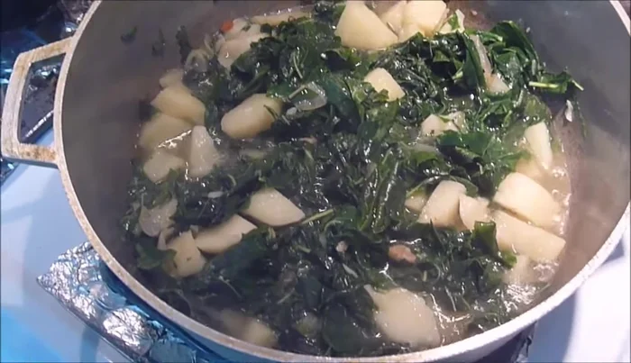 Stir well and cook until the leaves wilt and the excess water boils off.