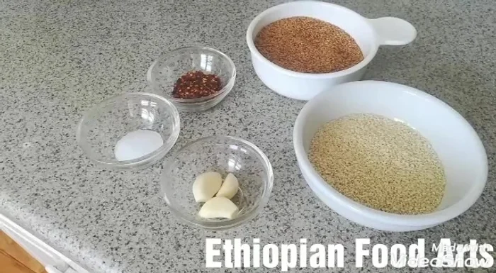 Add the flaxseed and sesame seeds to the pan. (This information is gathered from the mentions of these ingredients and inferred order of cooking)
