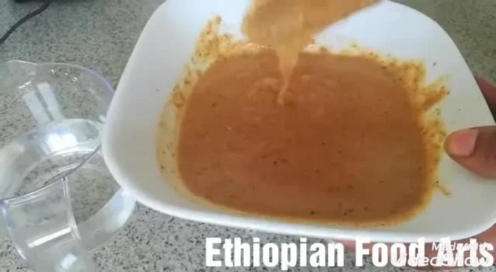 Begin by preparing your flaxseed and sesame seeds. If using whole seeds, you may grind them using a grinding stone, mortar and pestle, or a spice grinder for a finer texture. (This step is not explicitly detailed in the transcript, but is implied)