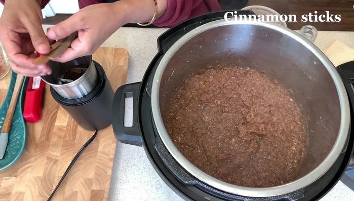 Add the spice blend and spiced Ethiopian butter (or substitute with high-fat butter like Kerrygold) to the onions and cook further.