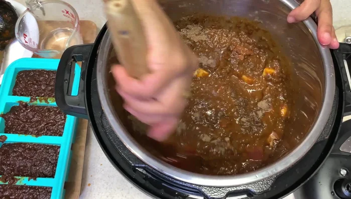 Once the base sauce is ready, portion it and freeze for future use. The author froze about 4 cups.