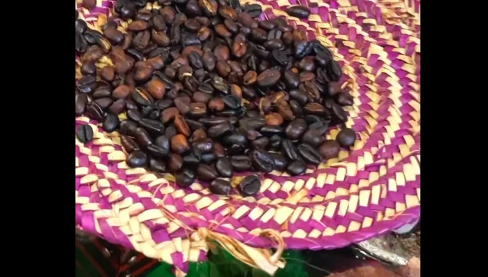Pour the roasted beans onto a flat surface to cool.