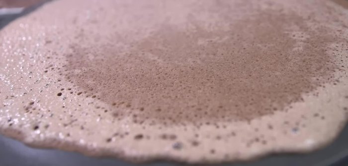 Once cooked, remove the injera from the pan.