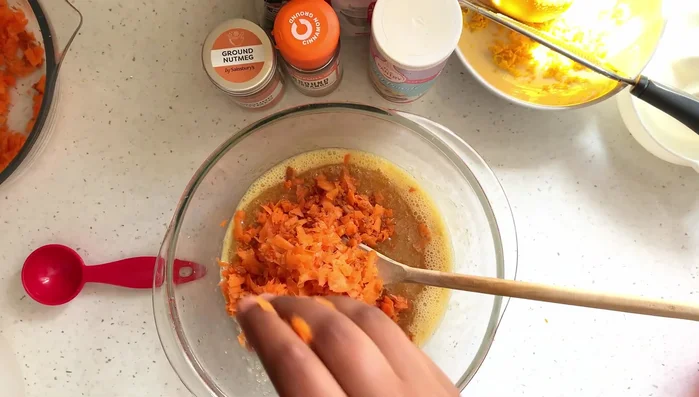 Add grated carrots.