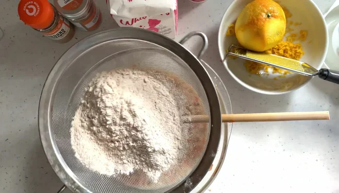 Gradually add the dry ingredients to the wet ingredients, mixing gently.