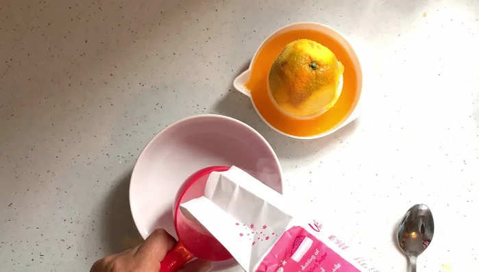 Prepare icing by combining icing sugar and orange juice until desired consistency is reached.