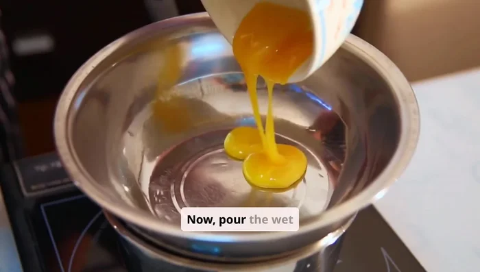 Pour wet ingredients into dry ingredients. Stir gently; don't overmix.