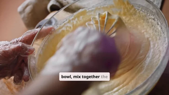 In a large bowl, mix together the flour, sugar, yeast, and salt.