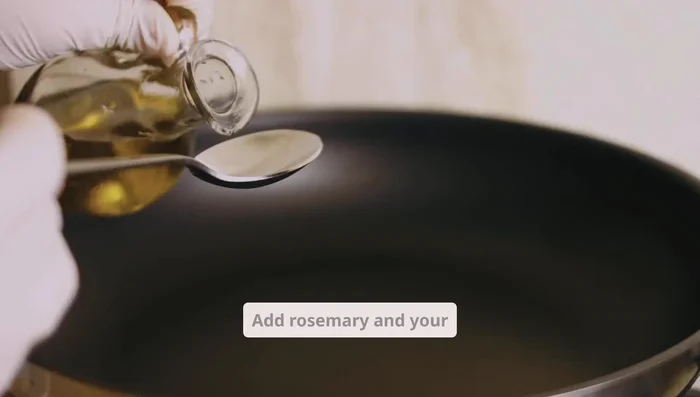 Add rosemary and your chosen carrier oil to a saucepan or double boiler.
