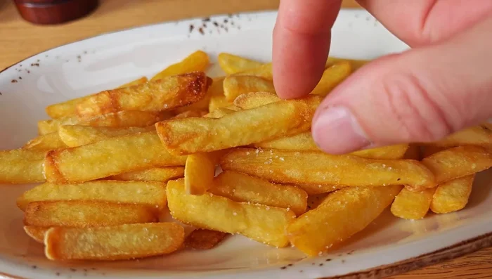 Increase oil temperature to 375°F (190°C). Fry the fries again for 2-3 minutes until golden and crispy.