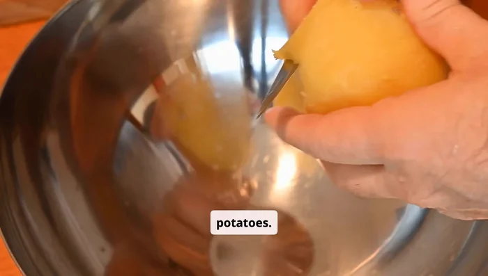 Peel the potatoes and cut them into thin sticks, about 1/4 inch thick. Try to keep them even for even cooking.