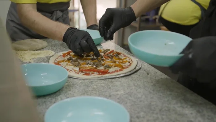 Preheat oven to 475°F (245°C). If using, preheat pizza stone. Punch down dough and roll it out into a 12-inch circle. Transfer to a parchment-lined baking sheet or pizza peel.