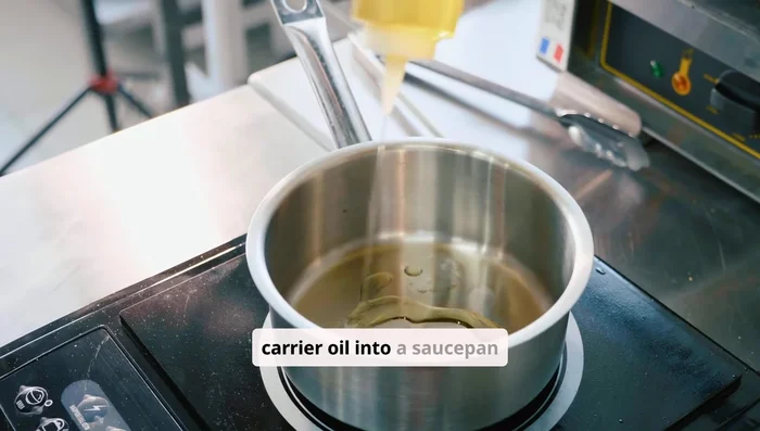 Combine with oil: Pour one cup of your chosen carrier oil into a saucepan and add the cloves.