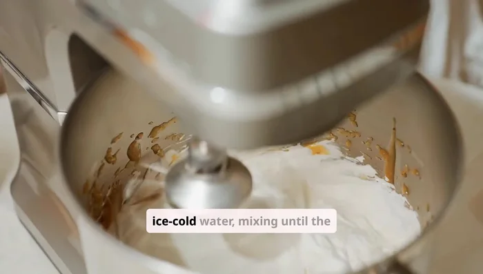 Gradually add ice cold water, mixing until the dough just comes together. Don't overmix.