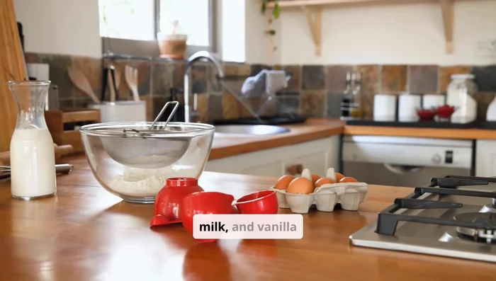 Mix in sour cream, milk, and vanilla extract. Gradually add dry ingredients to wet ingredients, mixing until just combined.
