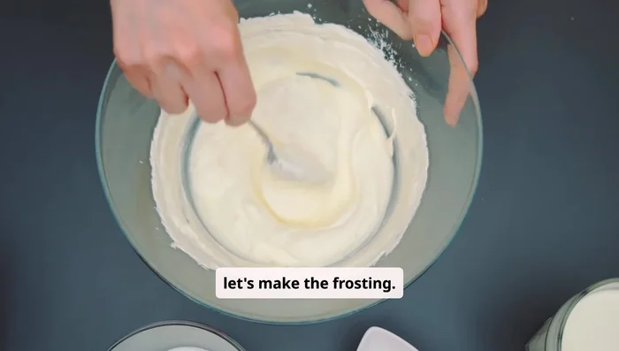 While cake cools, beat cream cheese and butter until smooth. Gradually add powdered sugar and vanilla extract, beating until fluffy.