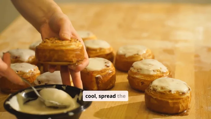 Once cake is completely cool, spread frosting evenly over the top. Garnish with fresh strawberries if desired.
