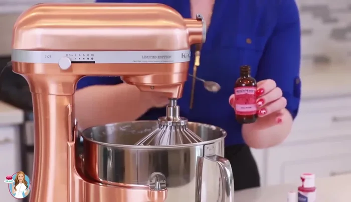 Add milk and rose water extract, mix for about a minute.