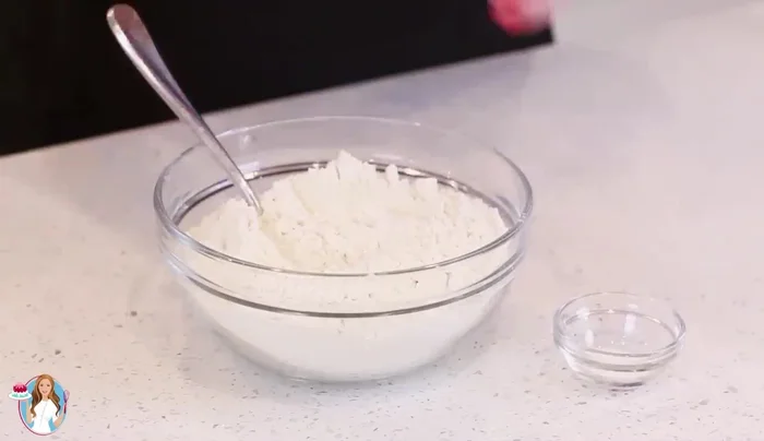 Combine flour, baking powder, and salt. Sift into the batter and mix on low speed until incorporated.