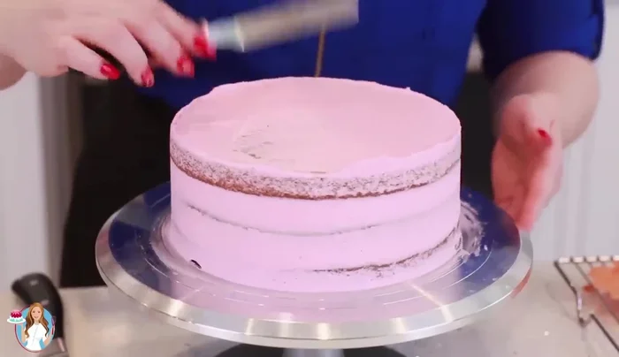 Apply a crumb coat of frosting, freeze for 10 minutes to set.