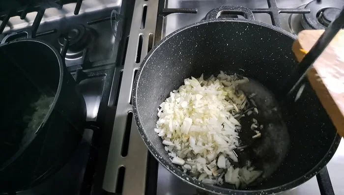 Add oil to a pan. Add onion and cook.