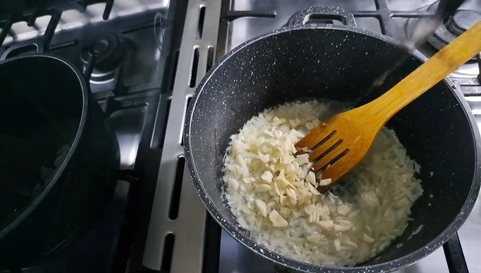 Add garlic and cook with the onion.