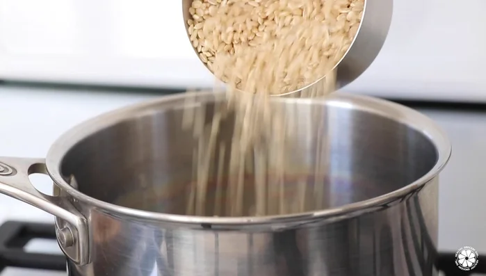 Cook brown rice according to package instructions.