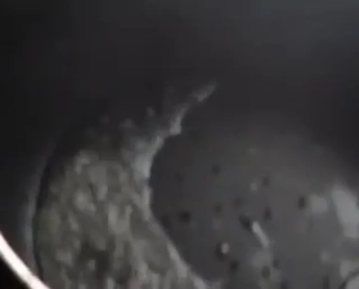 Heat a pan, and optionally, pour the curry through a metal pipe to serve.