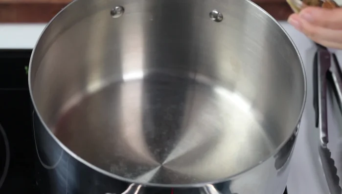 Heat a large pot over medium-high heat. Add olive oil (or bacon drippings).