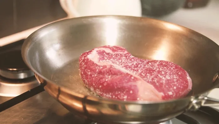 Cook the steak in a hot pan for 2-3 minutes per side, until medium-rare with a golden crust. For thicker steaks, finish in the oven. Rest for 5-10 minutes.