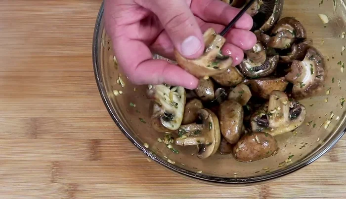 Thread mushrooms onto skewers, spacing them so they barely touch.