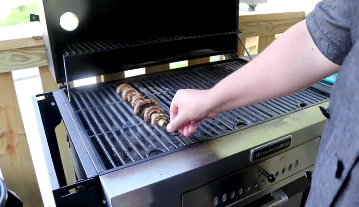 Grill mushrooms flat side down for 3-4 minutes per side.