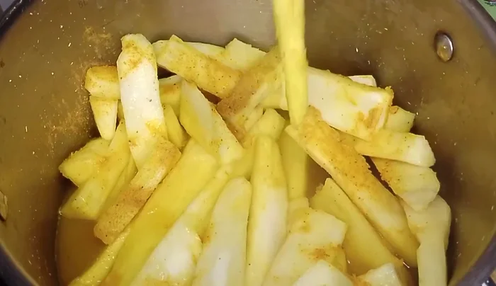 Drain the cassava slices thoroughly to remove excess water.
