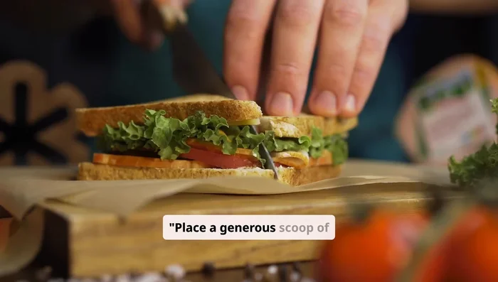 Place a generous scoop of tuna salad onto a slice of bread.