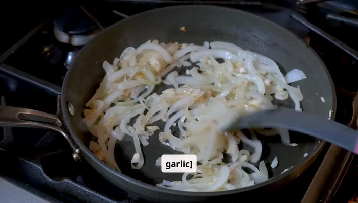 Sauté aromatics. In the same skillet, add 1 tsp of butter. Sauté diced onions until translucent. Add minced garlic and cook for another minute. Deglaze the pan with red wine, scraping up the flavorful bits.