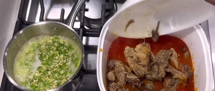 Add cooked chicken to the stew, stir, and continue cooking.
