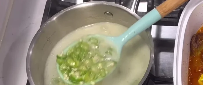 Add boiled okra to the stew, bring to a boil, then simmer for 2-3 minutes.