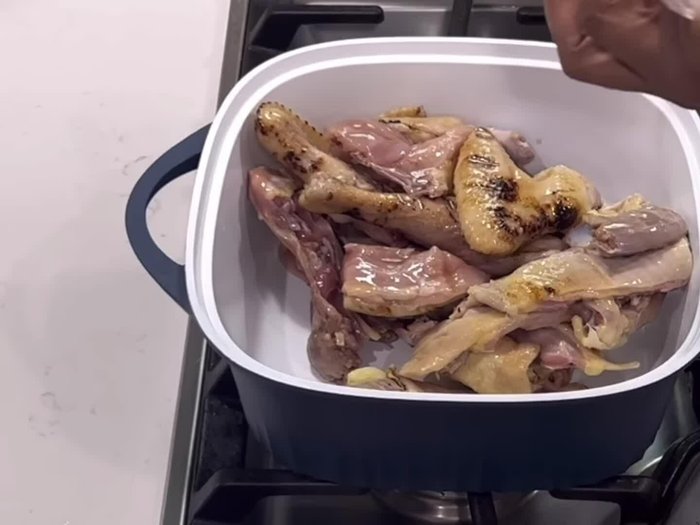 Clean chicken and add ginger powder, garlic salt, natural spice mix, chicken seasoning, and chopped onions. Stir until well combined, cover, and let it cook in its own juices or steam.